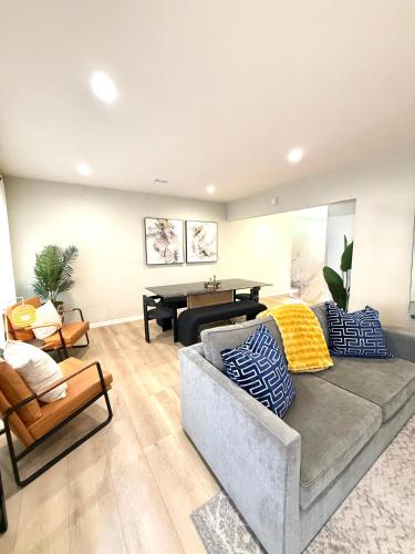 a living room with a couch and a piano at Coastal Escape in Redondo Beach in Redondo Beach