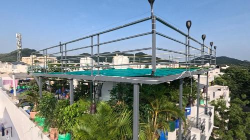 a building with a swimming pool on top of it at CHOUDHARY WHITE HOUSE Udaipur in Udaipur