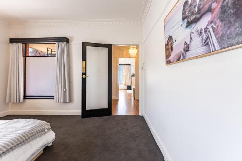 a bedroom with a bed and a window at 3 Bedrooms By The Lake, Top Location in Wendouree