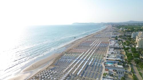an aerial view of a beach with buildings and the ocean at Hotel Carlton in Riccione