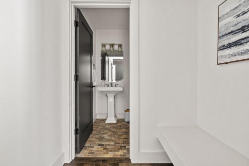 a bathroom with a sink and a mirror at Living My Best Life in Union Pier