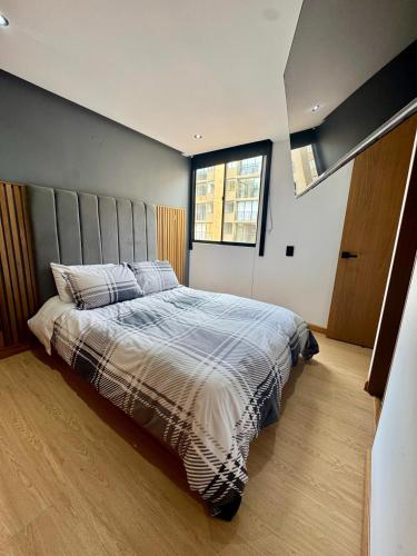 Ένα ή περισσότερα κρεβάτια σε δωμάτιο στο Apartamento de Lujo frente al CC Viva