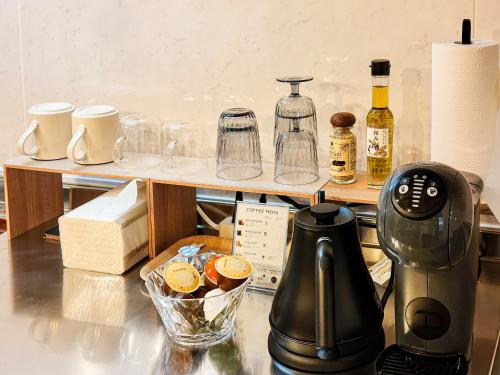 a coffee maker sitting on top of a counter at Blue Nest Takamatsu in Takamatsu