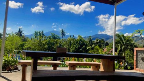 a wooden bench sitting on top of a table at Eco Moringa Garden in Banyuwedang