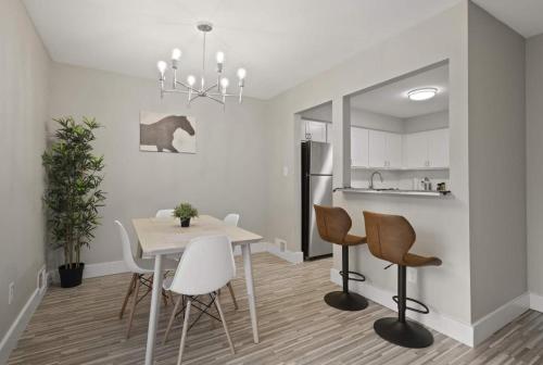a kitchen and dining room with a table and chairs at Relax & Unwind in Rochester Cozy Vacation Spot in Rochester Hills