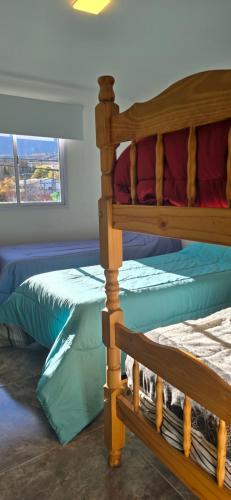 Cama o camas de una habitación en COMPLEJO LA CASCADA ESQUEL