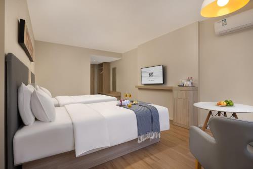 Postel nebo postele na pokoji v ubytování True Go Hotel x ---Wuhan Xinhua Road Union Hospital Branch