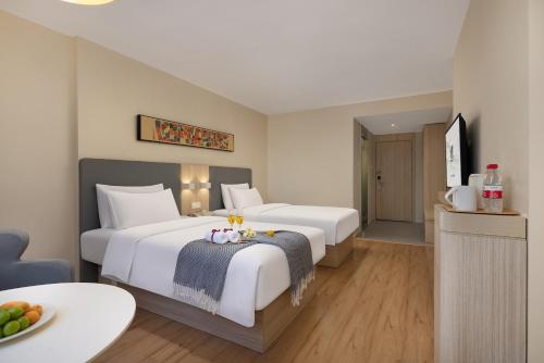 Postel nebo postele na pokoji v ubytování True Go Hotel x ---Wuhan Xinhua Road Union Hospital Branch