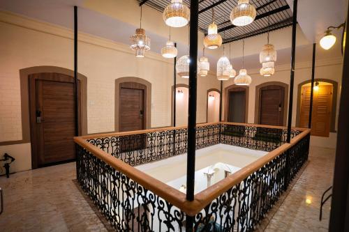 a bath tub in a room with many mirrors at Captain Villa Heritage House in Varanasi