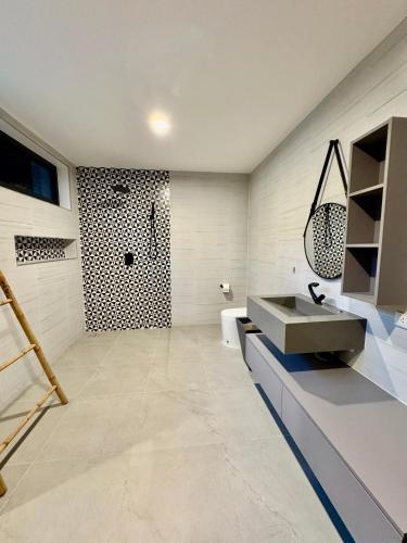 a bathroom with a sink and a shower at Villa harmony haven in Taling Ngam in Ban Khok Kroat