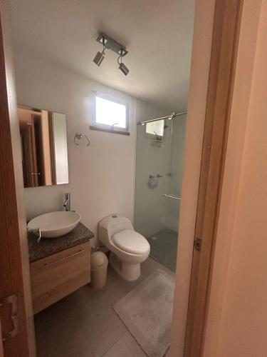 a bathroom with a toilet and a sink and a shower at Modern 3 bedroom apartment Monserrate 360 Santa Rosa in Estación El Salto