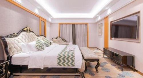 Postel nebo postele na pokoji v ubytování Enping Yucca Hotel