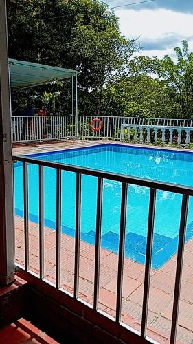 a view of a swimming pool from a balcony at Hotel ecoturístico villa marina in Rivera