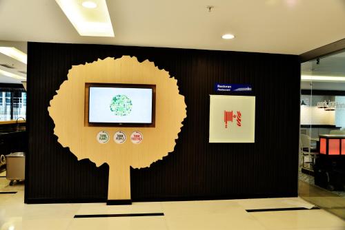 a wall with a picture of a tree on it at Park Inn by Radisson Ankara Cankaya in Ankara