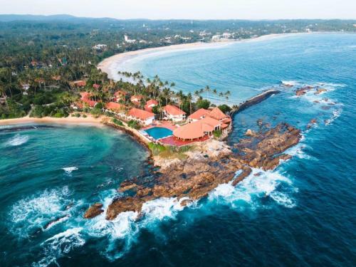 an aerial view of a resort on a island in the ocean at Little jay"s villa in Batigama