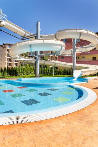 a large swimming pool with a water slide at Rena Hotel - All Inclusive in Sunny Beach