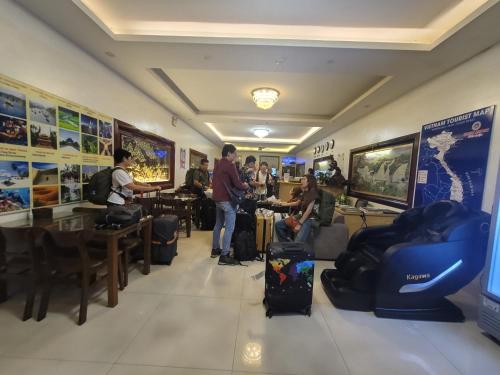 a group of people standing in a restaurant at Luxury Airport Hotel - Convenient & Friendly in Hanoi