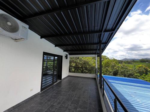 a view from the balcony of a house with a swimming pool at Apartamento con terraza Casa Finca pompano en La Unión Valle con piscina in San Luis