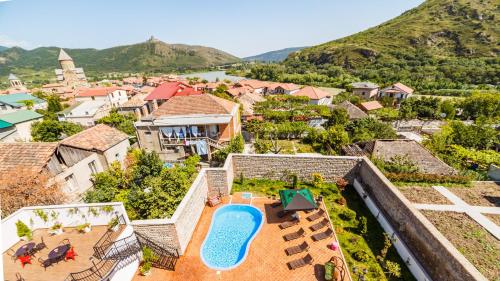 an aerial view of a villa with a swimming pool at Hotel Gino Wellness Mtskheta in Mtskheta