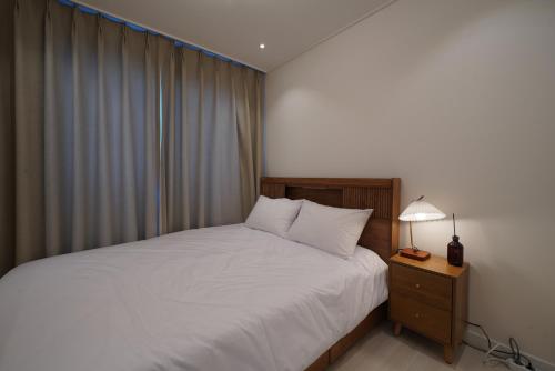 Postel nebo postele na pokoji v ubytování Seoul Felice