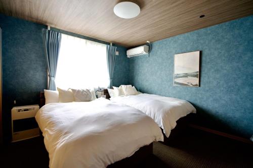 Postel nebo postele na pokoji v ubytování Green Hills Sapporo 5 bedroom 10 beds 2 bath 2 free parking spaces