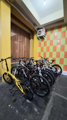 a bunch of bikes parked in a room at Huis TANTI Homestay Jember in Wirolegi