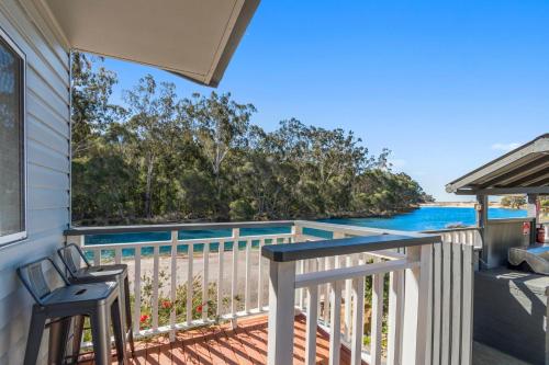 a house with a balcony with a view of the ocean at Ingenia Holidays Eden Beachfront in Eden