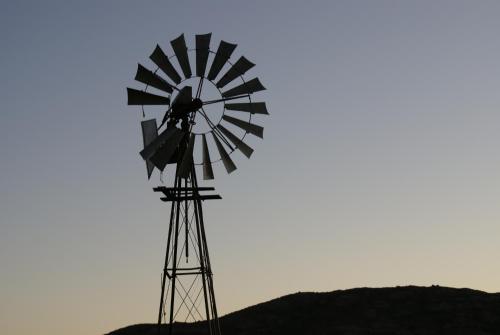 a windmill sitting on top of a hill at Ladismith Manor in Ladismith