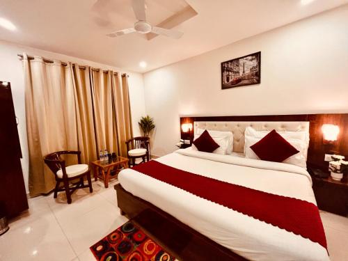a bedroom with a large bed in a room at Hotel The Pacific, Haridwar in Haridwār