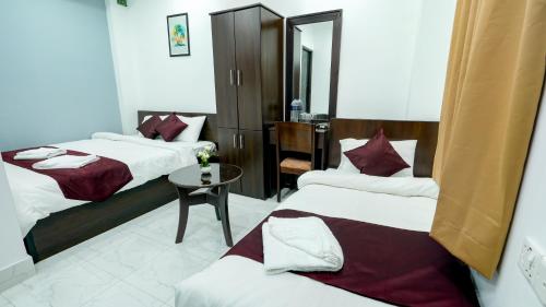 Ένα ή περισσότερα κρεβάτια σε δωμάτιο στο Hotel Plaza Sylhet