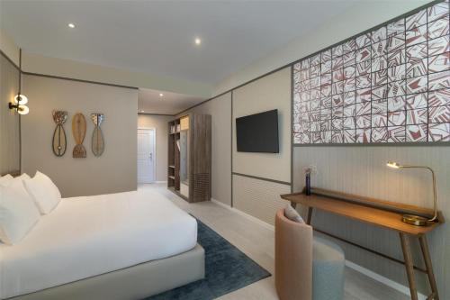 a hotel room with a bed and a desk at Hyatt Centric Santo Domingo in Santo Domingo