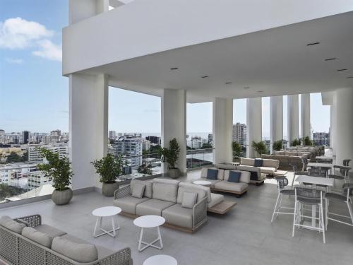 a lobby with couches and tables on a building at Hyatt Centric Santo Domingo in Santo Domingo