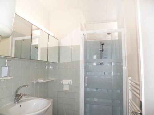 a bathroom with a shower and a sink at Apartment Le Suffren in Le Barcarès