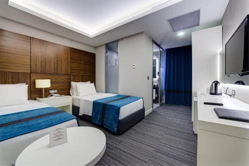 The Menord Hotelにあるベッド