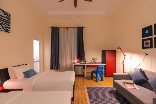 Postel nebo postele na pokoji v ubytování Moon Garden Hotel