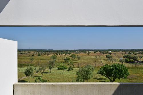 a view of a field with trees in the distance at Pousada Mosteiro do Crato in Crato