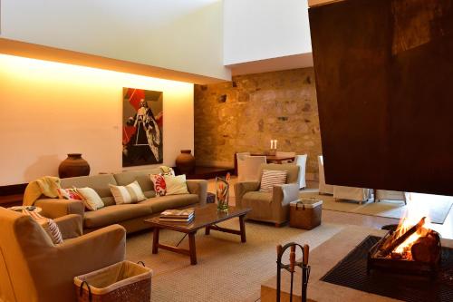 a living room with a couch and a table at Pousada Mosteiro do Crato in Crato