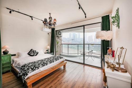 a bedroom with a bed and a large window at Baihong Riverview Apartment-Hongya Cave in Chongqing