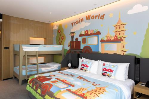 a childrens bedroom with a train world mural on the wall at Crowne Plaza Quanzhou Riverview by IHG in Quanzhou