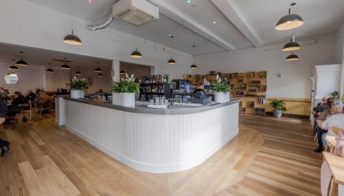 a bar in a restaurant with people sitting at tables at Ararat Hotel in Ararat