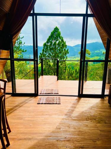 an open room with a view of the mountains at Eco Cabana Bellwood in Nikawatawana