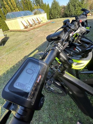 a close up of a motorcycle parked on the grass at Happy Jura in Biskupice