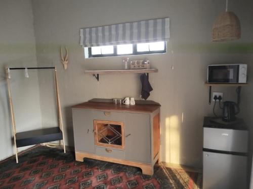 Η κουζίνα ή μικρή κουζίνα στο Aloe Thorn Self Catering