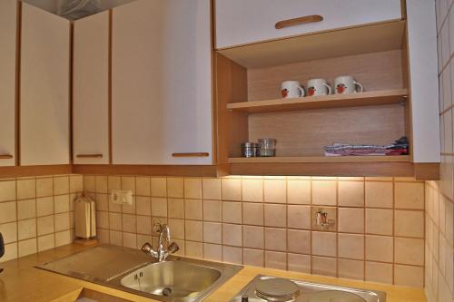 a kitchen with a sink and a counter top at Oberauhof in Kleinarl
