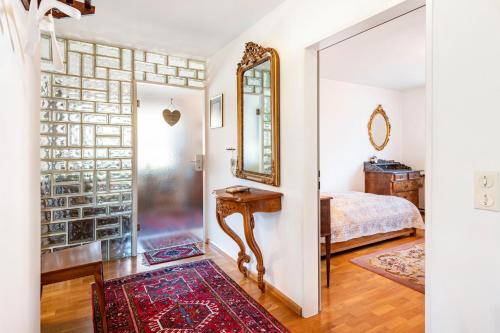 a bedroom with a mirror and a bed in a room at Ferienwohnung Kropp in Steinen