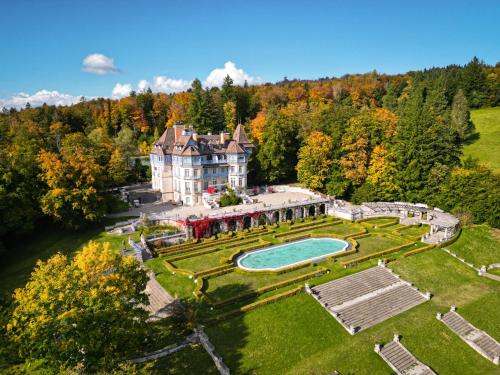 an aerial view of an estate with a swimming pool at Château des Avenieres in Cruseilles