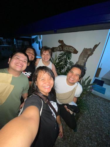 a group of people posing for a picture at Beach House, San Juan, La Union in San Juan