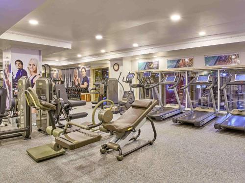 a room with a bunch of tread machines in a gym at Rixos President Hotel Astana in Astana