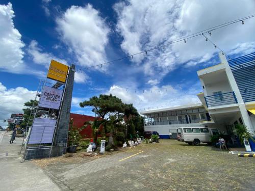 a sign in a parking lot in front of a building at The Strype Hotel Tagaytay in Tagaytay