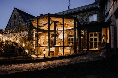 a large glass house with lights in it at Sonnenhotel Hoher Hahn in Schwarzenberg